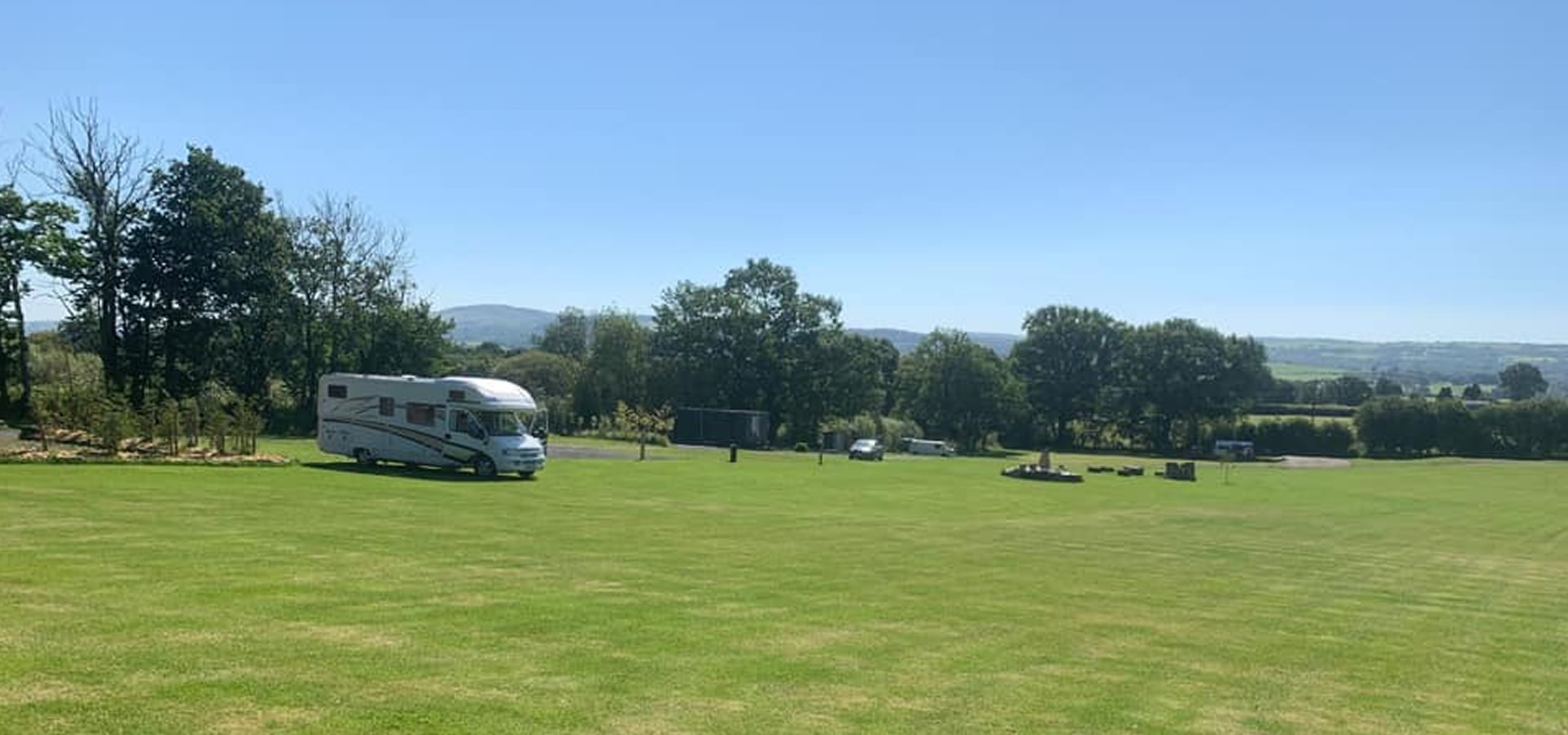 Caravan and motorhome touring pitches at Brynhyfryd Farm CL site in Carmarthenshire